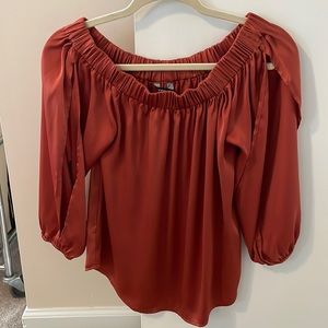 Burnt orange satin like off shoulder Express Top